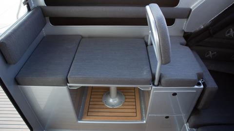 Wheelhouse drop down table seating with two drawers, top entry storage and flip up bunk extension