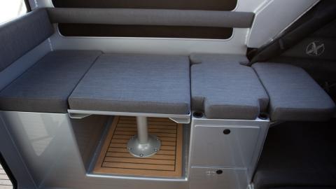 Wheelhouse drop down table seating with two drawers, top entry storage and flip up bunk extension