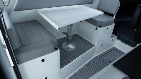 Offset door drop down table seating with four drawers, removable back rest, drop in bunk rail and vynal upgrade