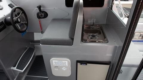 Enclosed wheelhouse starboard module with solid backrest, fridge and cooker/sink combo