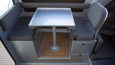 Wheelhouse drop down table seating with two drawers, top entry storage and flip up bunk extension