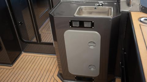Wheelhouse wall external module with sink, gas bottle or caliphont storage