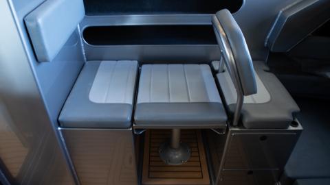 Enclosed wheelhouse drop down table seating with vynal upgrade with shower/toilet cubicle 